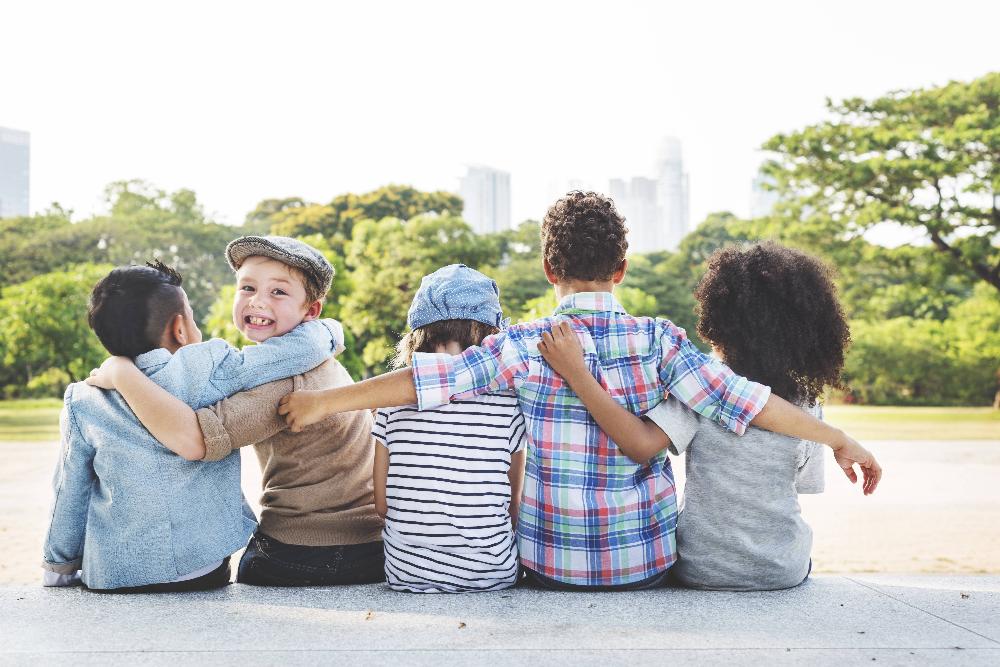 group of children hugging | childrens dentist scarborough