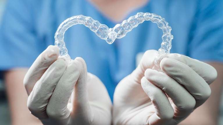 A picture showing two clear aligners held side by side in Scarborough, ON