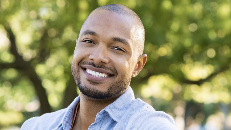 A smiling man after Wisdom Teeth Removal in Scarborough ON
