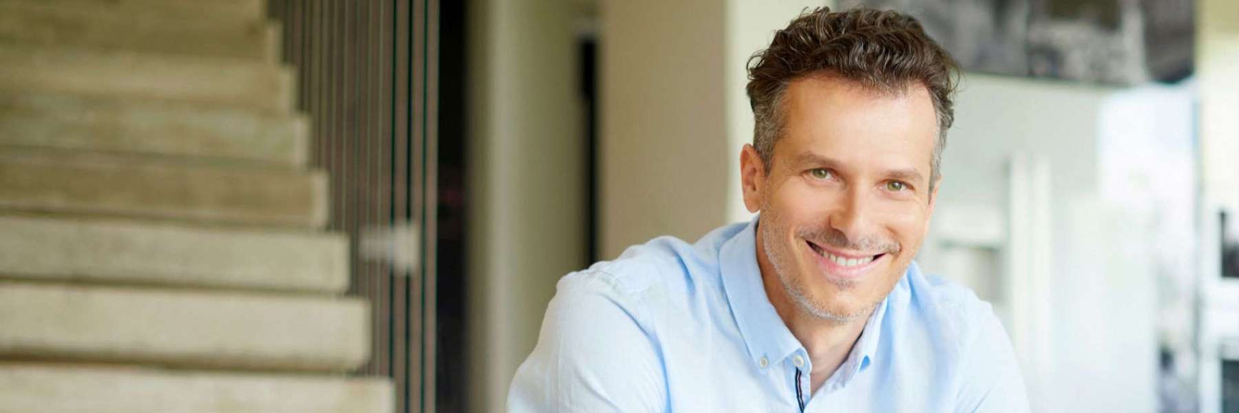 A man smiling after a Dental Implants treatment in Scarborough, ON