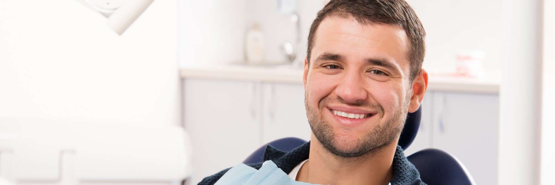 A man smiling showing beautiful teeth after an Orthodontic Braces treatment in Scarborough, ON