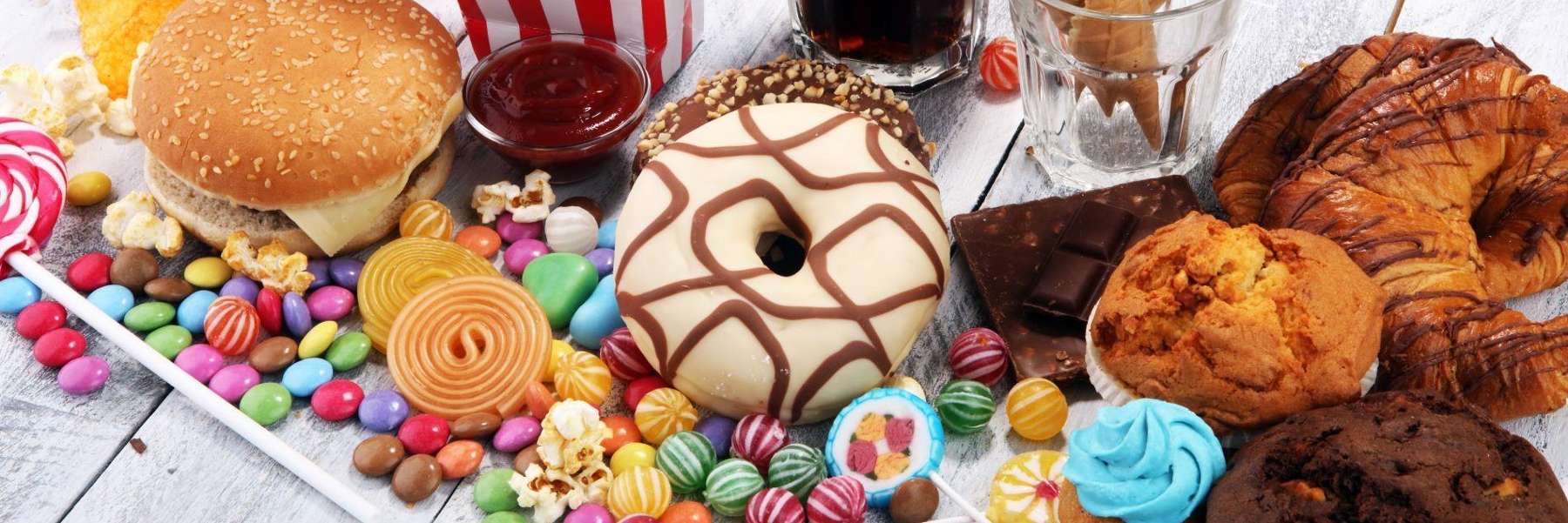 close up of donut, muffin, and candy | dentist scarborough on